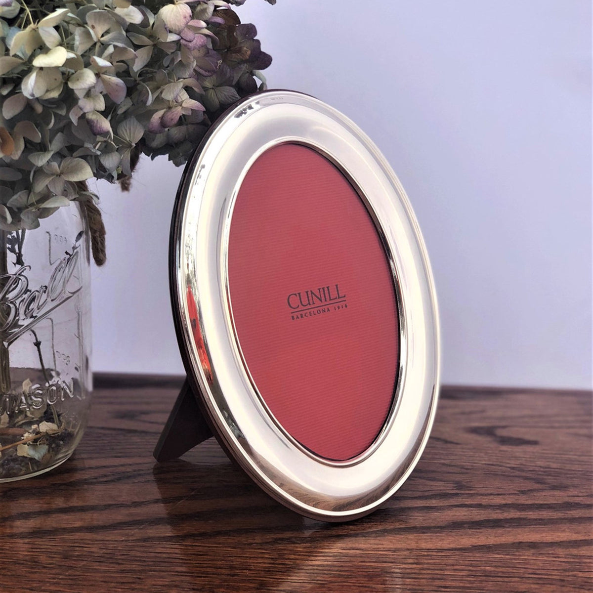An image of Cunill Sterling Silver Oval Plain Picture Frame