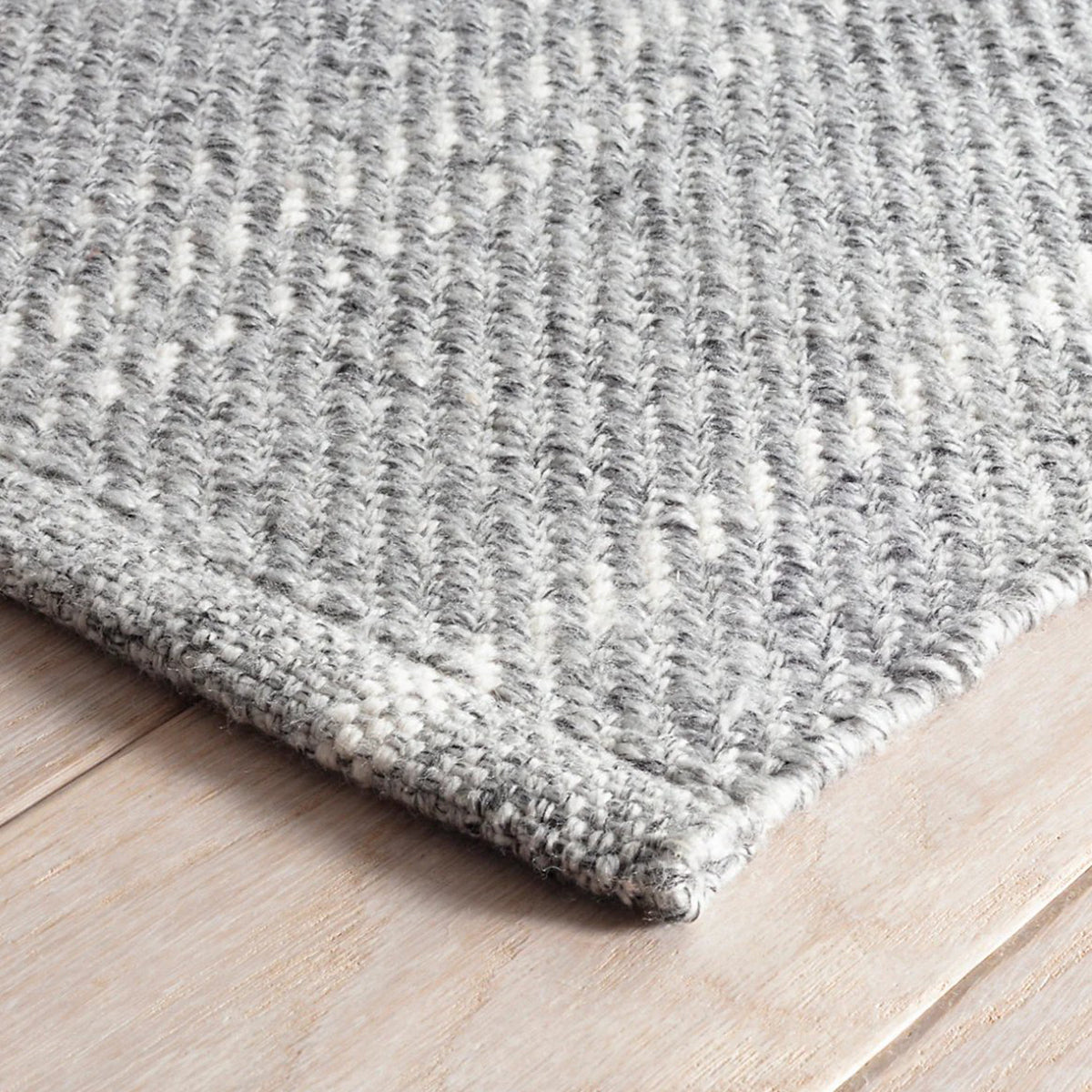 An image of Dash And Albert Melange Stripe Grey/Ivory Indoor/Outdoor Rug 5 x 8'